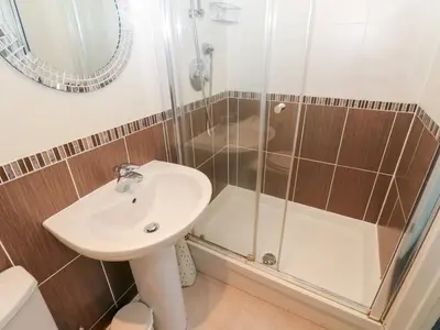 a bathroom with a sink and a shower at Linga House - 3 Bedrooms - Sleeps 5 in Frizington