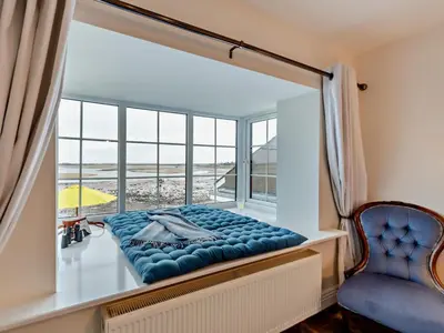 a window seat in a room with a view of the beach at 2 Bed in Ravenglass oc-95884 in Ravenglass