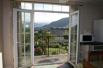 an open door to a balcony with a view at StoneyAcre in Keswick