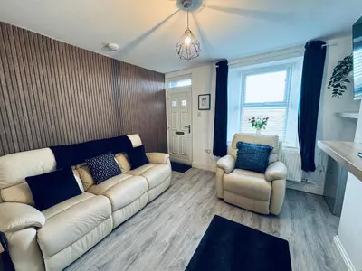 a living room with a couch and two chairs at Keekle Cottage - 2 Bedrooms - Sleeps 4 in Cleator Moor