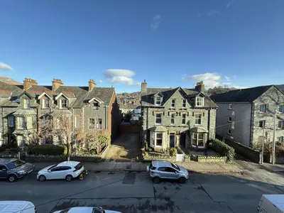 a group of houses with cars parked in a parking lot at 45 Eskin Street in Keswick