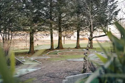 a park with trees and a swing at The Retreat - Ridgestone in Penruddock