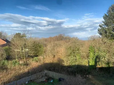 a view of a field with trees and a fence at Lilac Cottage - Fell views & walks from the door in Cleator Moor