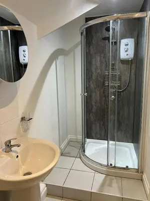 a bathroom with a shower and a sink at Lakenhow in Seascale