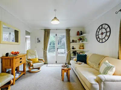 a living room with a couch and a table at 1 Bed in Maybole 93562 in Maybole