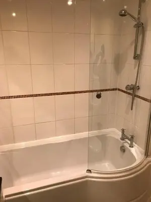 a bathroom with a shower and a bath tub at Lovely Furnished Apartment 2 in Carlisle