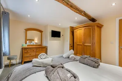 a bedroom with a large bed with towels on it at 3 Bed in Isel oc-i30816 in Sunderland