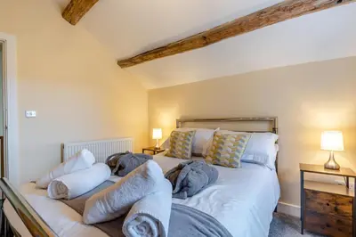 a bedroom with a large white bed with pillows at 3 Bed in Isel oc-i30816 in Sunderland