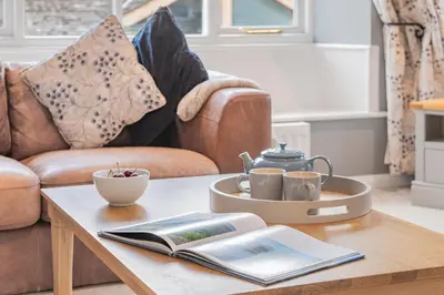 a coffee table with a tea set on top of it at Cozy Lake District House on the fells in Ambleside