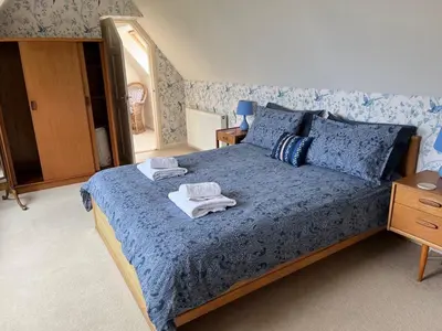 a bedroom with a bed with towels on it at Lonsdale in Rockcliffe