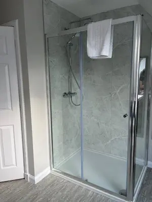 a shower with a glass door in a bathroom at Lonsdale in Rockcliffe
