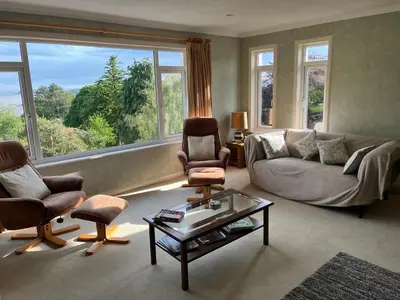a living room with a couch and chairs and a table at Lonsdale in Rockcliffe