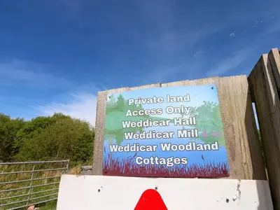 a sign that is on the side of a fence at Silverbirch Cottage - 3 Bedrooms - Sleeps 6 in Frizington