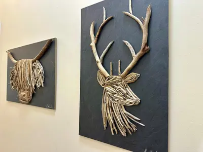a pair of antlers hanging on a wall at Sea Ayr - City Centre Apartment in Ayr