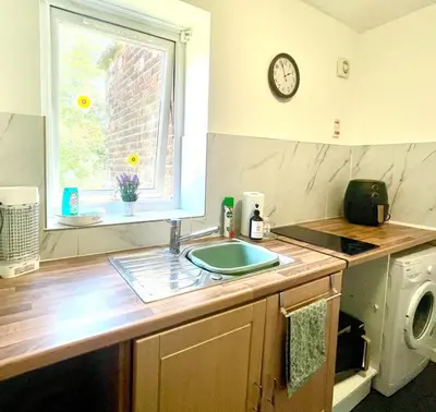 a kitchen with a sink and a window at No23 - Bright & spacious 2nd floor flat - PET friendly - Noon check out in Stanwix