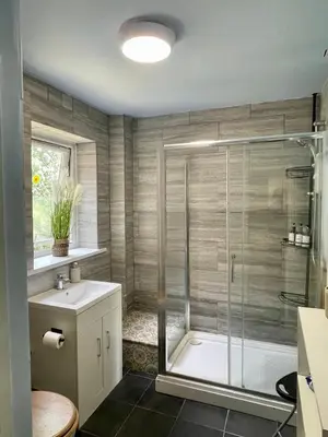 a bathroom with a shower and a sink at No23 - Bright & spacious 2nd floor flat - PET friendly - Noon check out in Stanwix