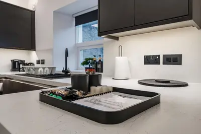 a kitchen counter with a tray of food on it at Modern Town House In Cockermouth in Cockermouth