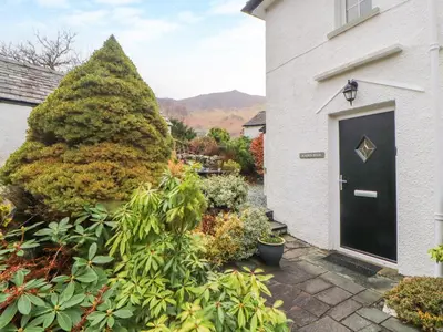 a front door of a house with a bunch of plants at Maiden Moor in Keswick