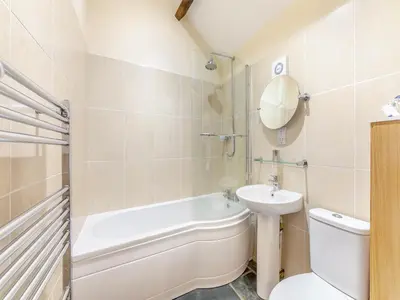 a bathroom with a sink and a toilet and a bath tub at Eight Byre - Uk48913 in Allonby
