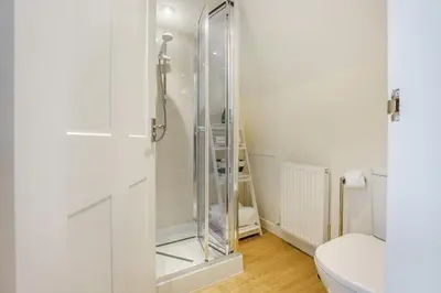 a bathroom with a glass shower with a toilet at 2 Bed in Kirkcudbright oc-a30803 in Kirkcudbright