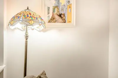 a lamp in a room with a picture on the wall at 2 Bed in Kirkcudbright oc-a30803 in Kirkcudbright