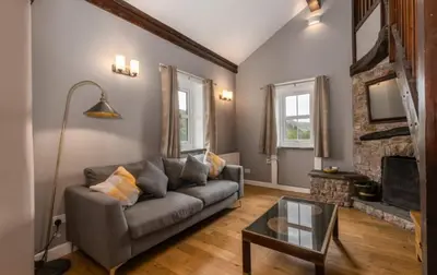 a living room with a couch and a table at King George IV Inn in Eskdale