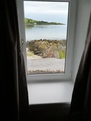 a window view of the ocean from a room at Munro Cottage in Rockcliffe