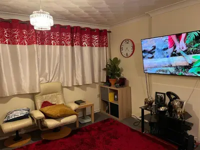 a living room with a couch and a tv at IFYLOVESITt2 in Moffat