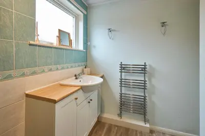 a bathroom with a sink and a mirror at Host & Stay - Trinity Way in Keswick