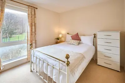 a bedroom with a white bed and a window at Host & Stay - Trinity Way in Keswick