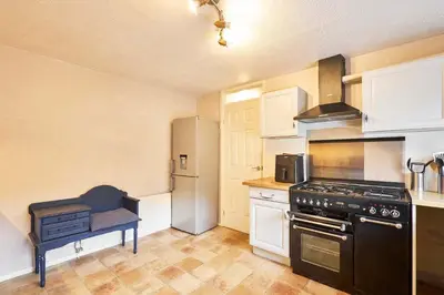 a kitchen with a stove and a refrigerator at Host & Stay - Trinity Way in Keswick