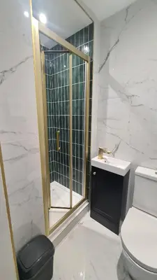 a bathroom with a shower and a toilet and a sink at 5 Bedrooms Sleeps 10 Full Kitchen Parking in Ayr