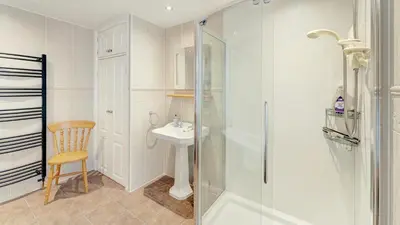 a bathroom with a shower and a sink at Stanley House in Bassenthwaite