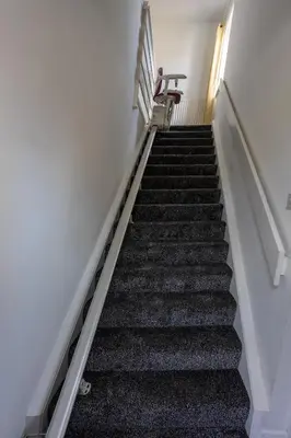 a stairway with a bench sitting at the top at Charming 2br Maisonette In Carlisle Center in Carlisle