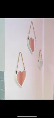 a group of hearts hanging on a wall at Warwick Studio Spaces in Carlisle