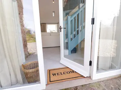 a welcome sign in front of a door at The Roost in Carlisle