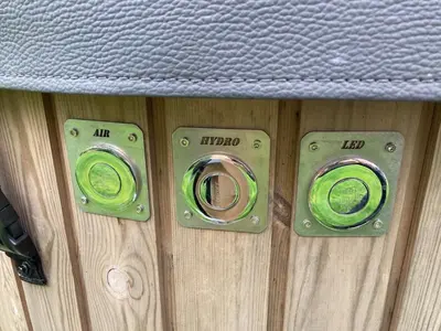 a pair of speakers on a wooden wall at Orchard Cottage At Gretna in Gretna