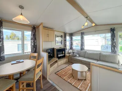 a living room with a couch and a table at The Haven in Cockermouth