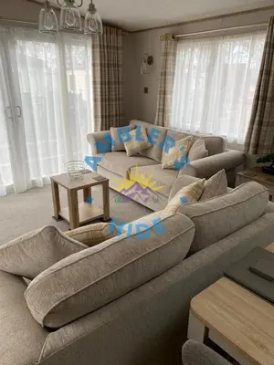 a living room with a couch and a table at Amblers Hide, Brigham, Cockermouth, Cumbria in Cockermouth