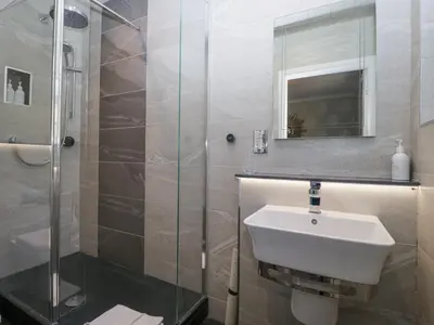 a bathroom with a sink and a shower at Raise View House in Ambleside