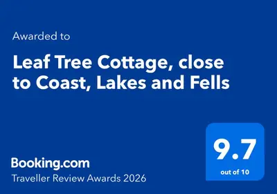 a blue sign with the words leaf tree cottage close to coast lakes at Leaf Tree Cottage, close to Coast, Lakes and Fells in Workington