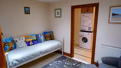 a laundry room with a washer and dryer at 9 Millburn Street in Kirkcudbright