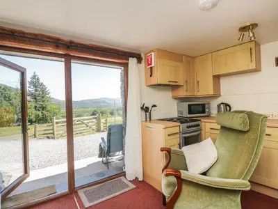 a kitchen with a view of a mountain at Wren's Nest in Keswick
