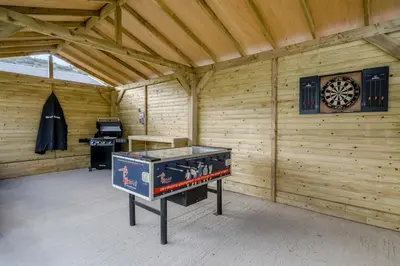 a room with a ping pong table and a dart board at 3 Bed in Cockermouth oc-o31515 in Embleton