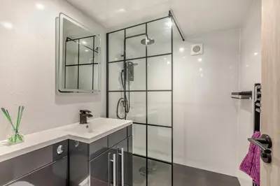 a bathroom with a sink and a shower at 1 Bed in Cockermouth oc-s31514 in Embleton