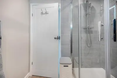 a bathroom with a shower with a glass door at 2 Bed in Braithwaite oc-p31730 in Braithwaite