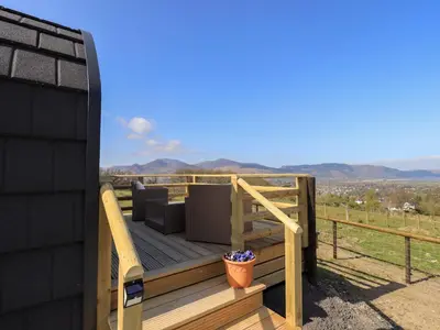 a deck with a view of the mountains at Shepherds View in Keswick
