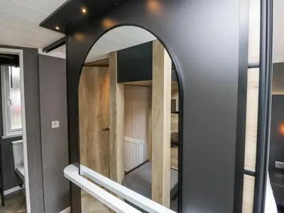 a large mirror in a room with a room at Sail Luxury Family Pod in Keswick