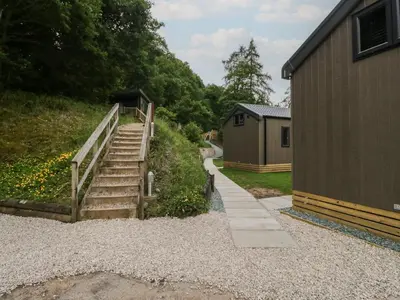 a set of stairs next to a building at Lingy Luxury Family Pod in Keswick