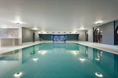 a large swimming pool in a building at The Sanctuary - Ridgestone in Watermillock